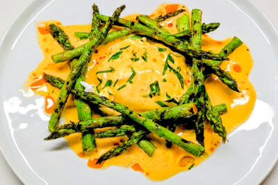 Grilled Asparagus with Calabrian Chili Hollandaise and Poached Egg